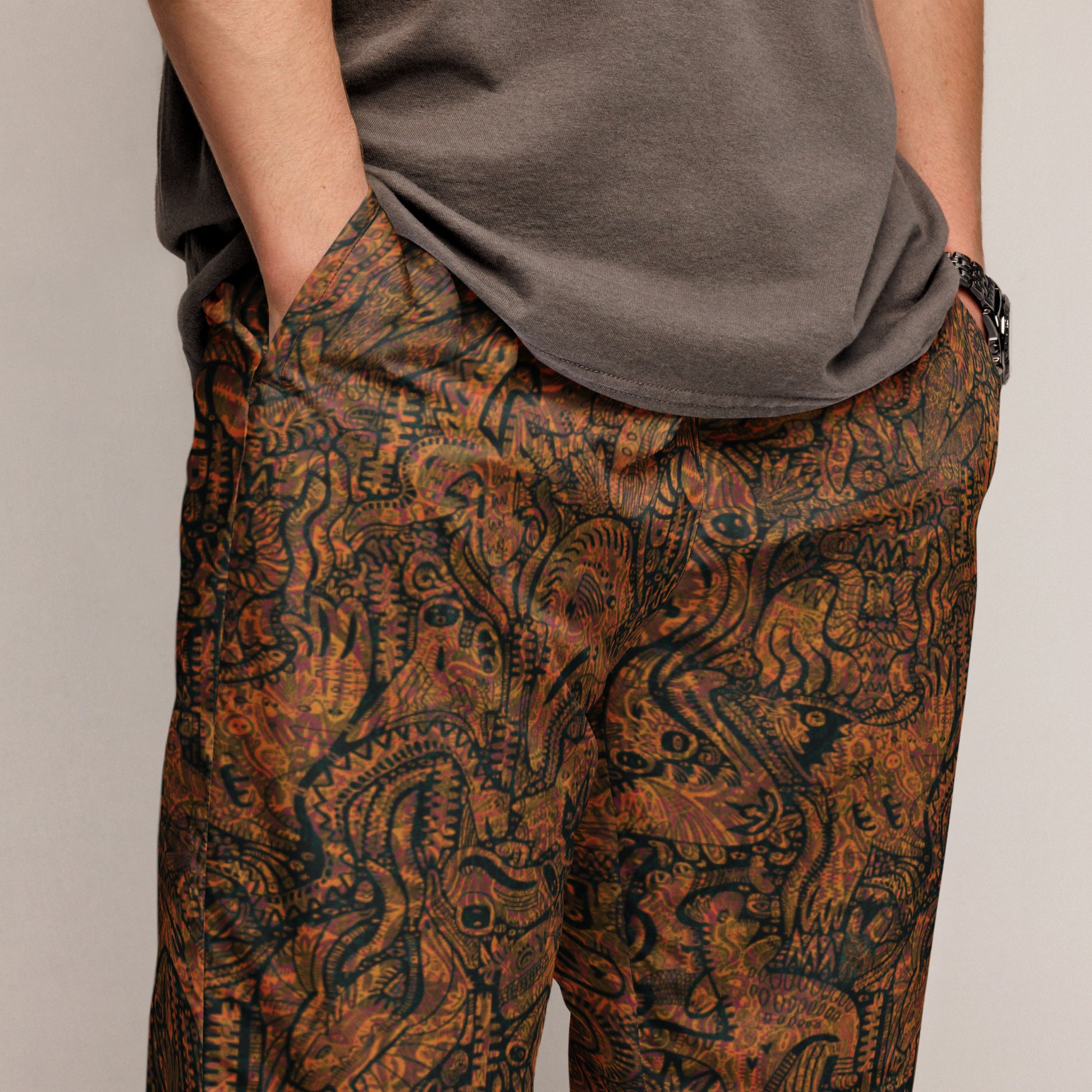 Brown and orange Dinosaur Nan Edition Joggers – unisex festival streetwear by Fowl Plays Print Emporium