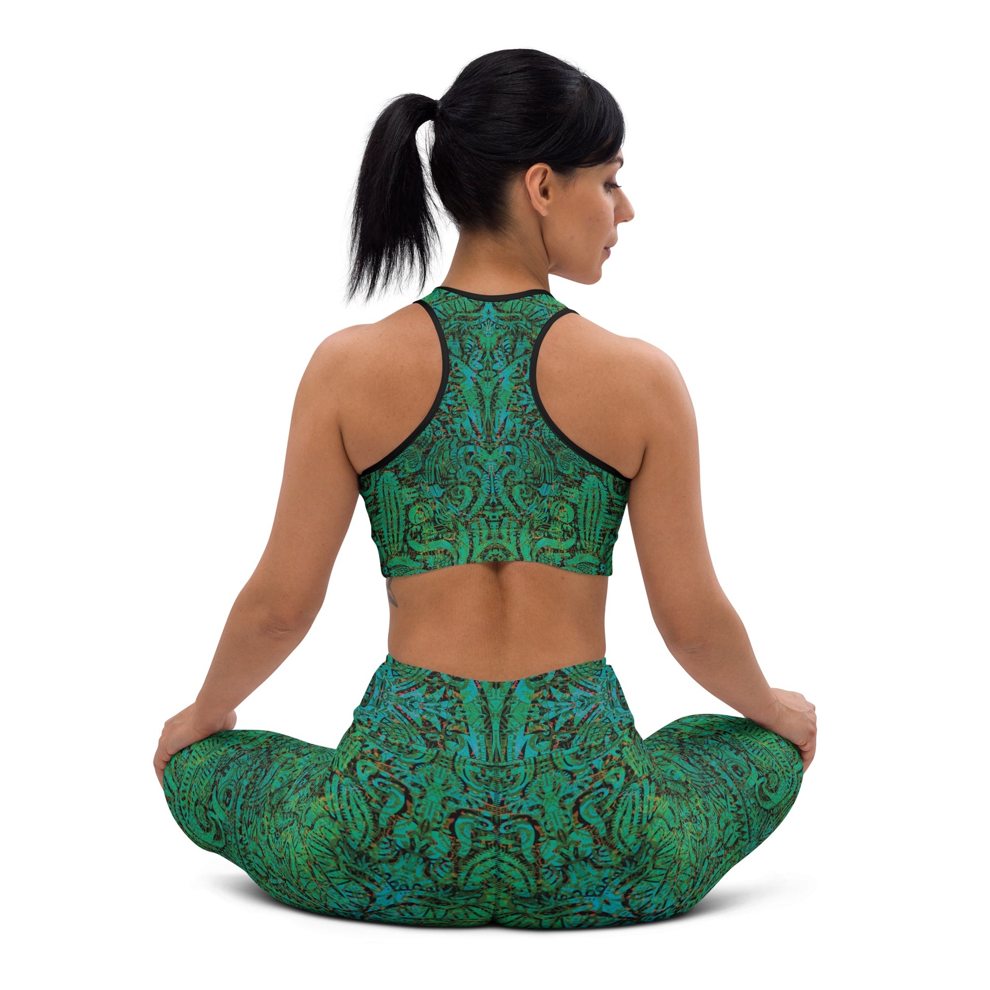 Model wearing turquoise mandala desert leggings and crop top from behind