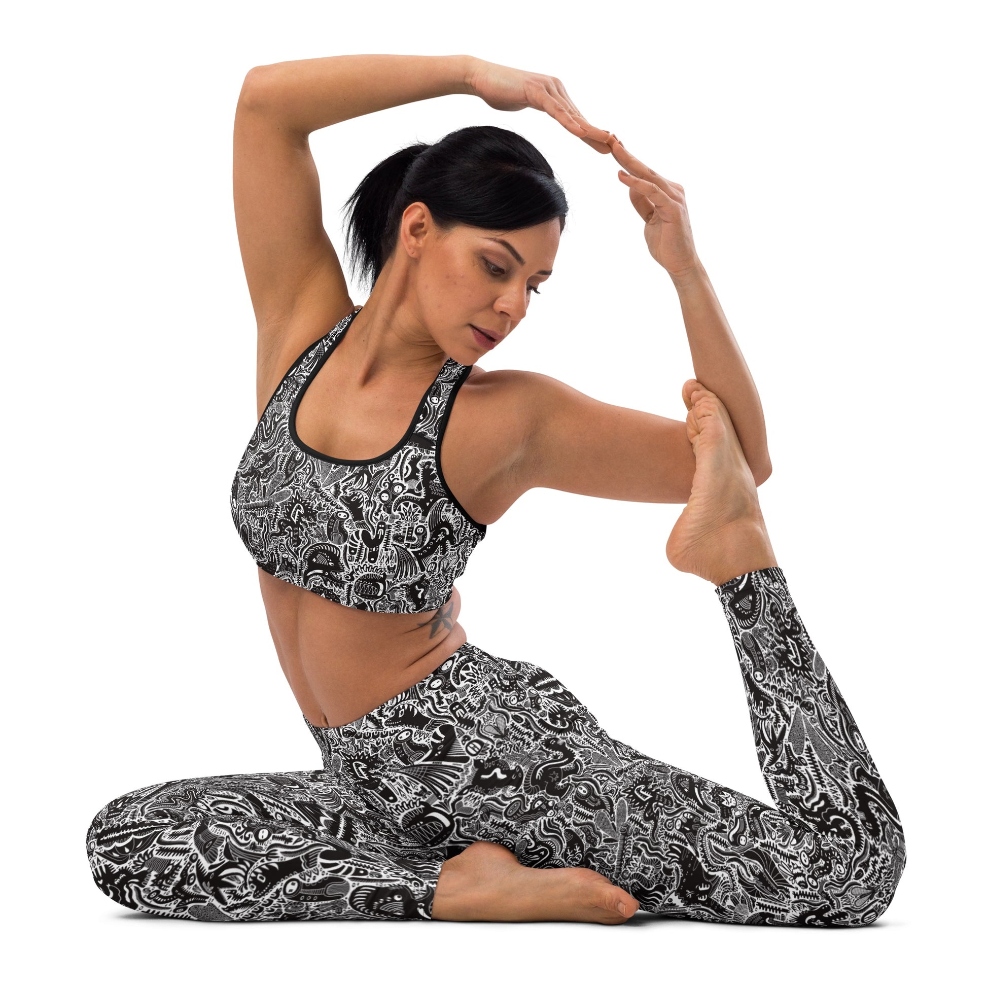 Black and white dinosaur print leggings and crop top on yoga model front – Monochrome Edition by Fowl Plays Print Emporium.