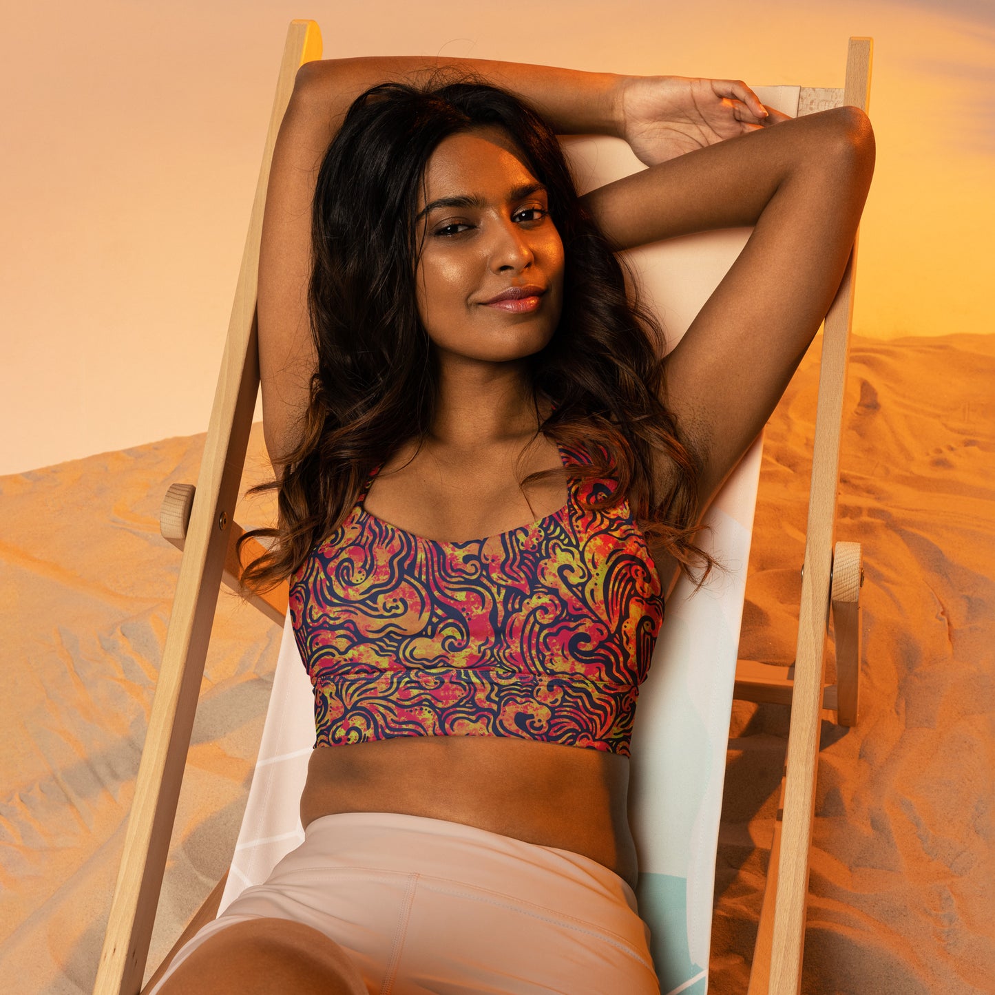Blue, orange and pink psychedelic long line sports bra crop top inspired by ocean waves – exclusive sustainable design by Fowl Plays Print Emporium.