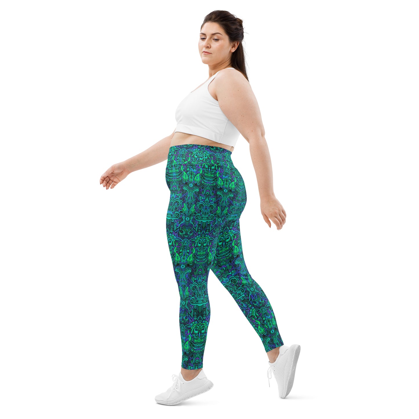 Model wearing plus size turquoise and purple psychedelic yoga leggings by Fowl Plays
