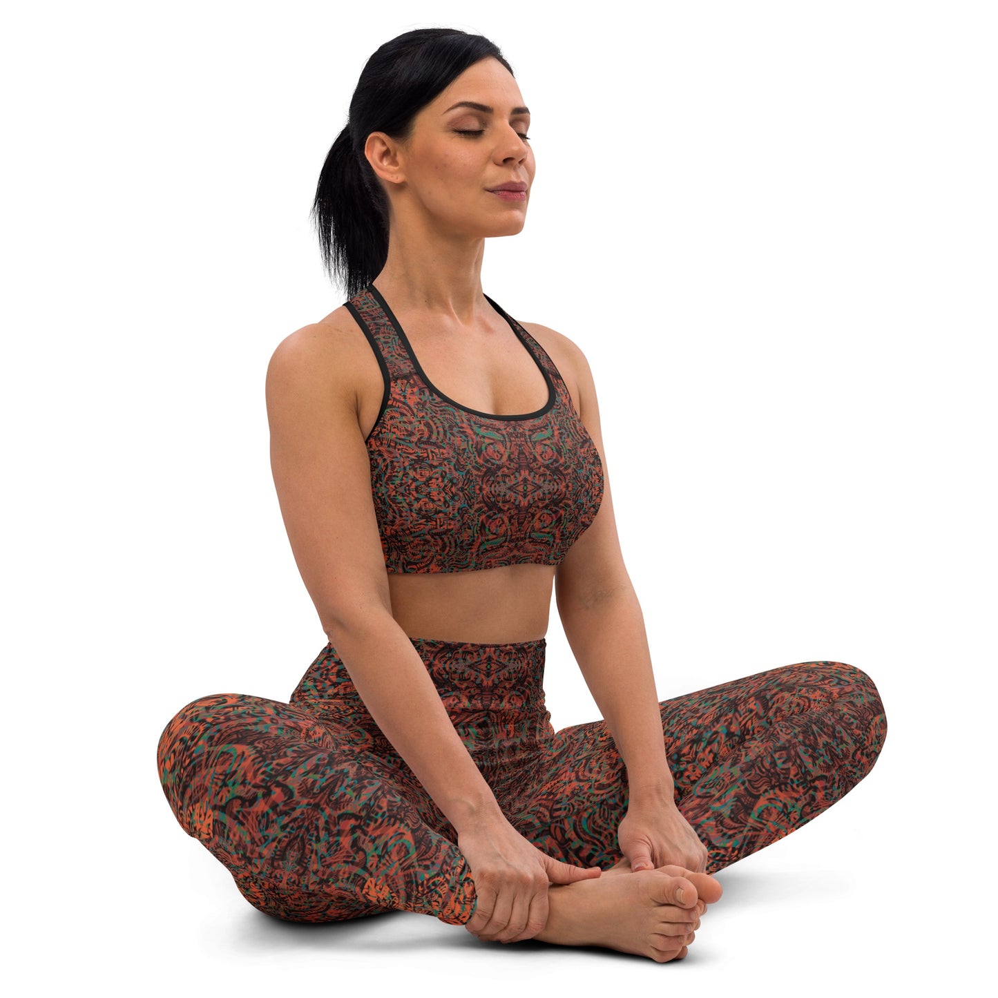 Model wearing kaleidoscope leggings and crop top in yoga pose
