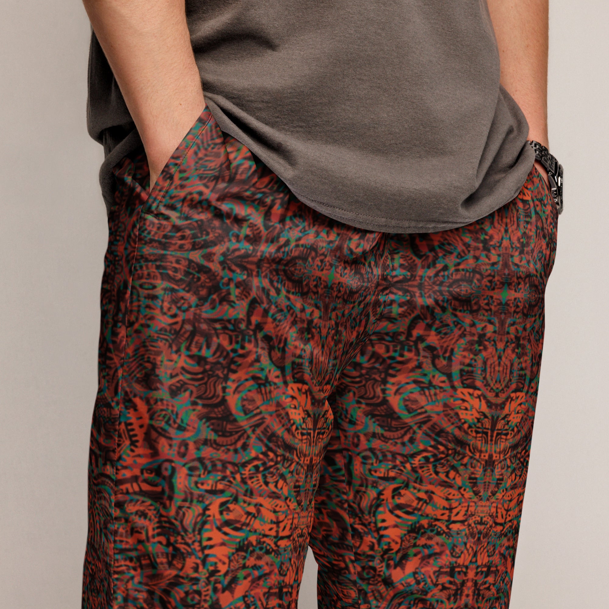 Orange, blue, and green Tribal Kaleidoscope joggers – unisex festival streetwear by Fowl Plays Print Emporium