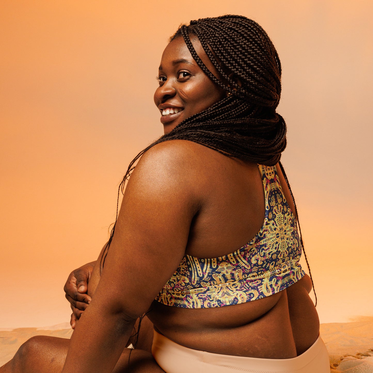 Blue, yellow and pink psychedelic crop top inspired by octopuses – exclusive ocean-themed design by Fowl Plays Print Emporium.