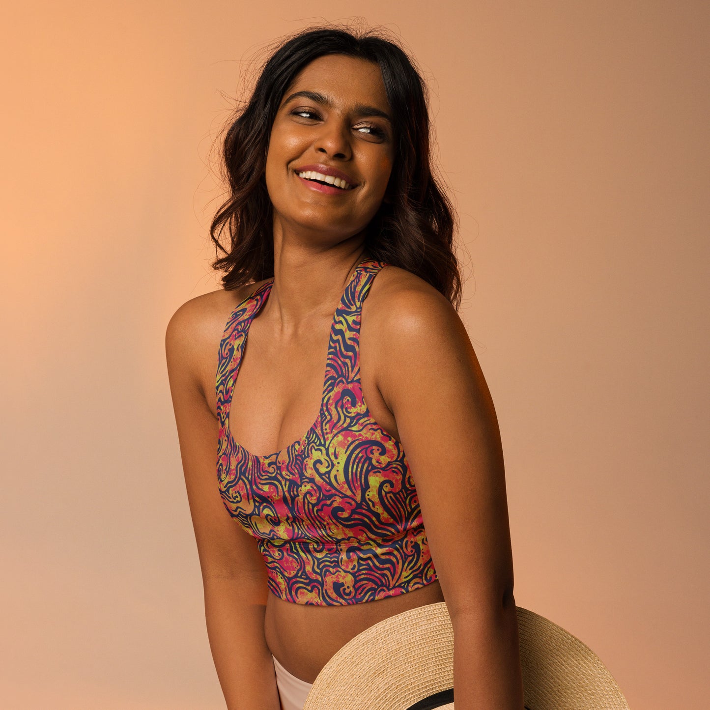 Blue, orange and pink psychedelic long line sports bra crop top inspired by ocean waves – exclusive sustainable design by Fowl Plays Print Emporium.