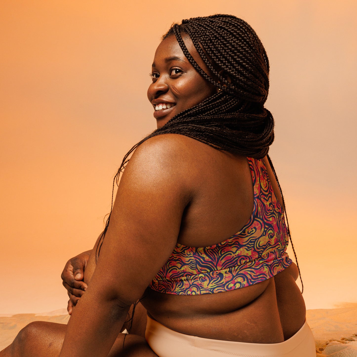 Blue, orange and pink psychedelic long line sports bra crop top inspired by ocean waves – exclusive sustainable design by Fowl Plays Print Emporium. plus size back