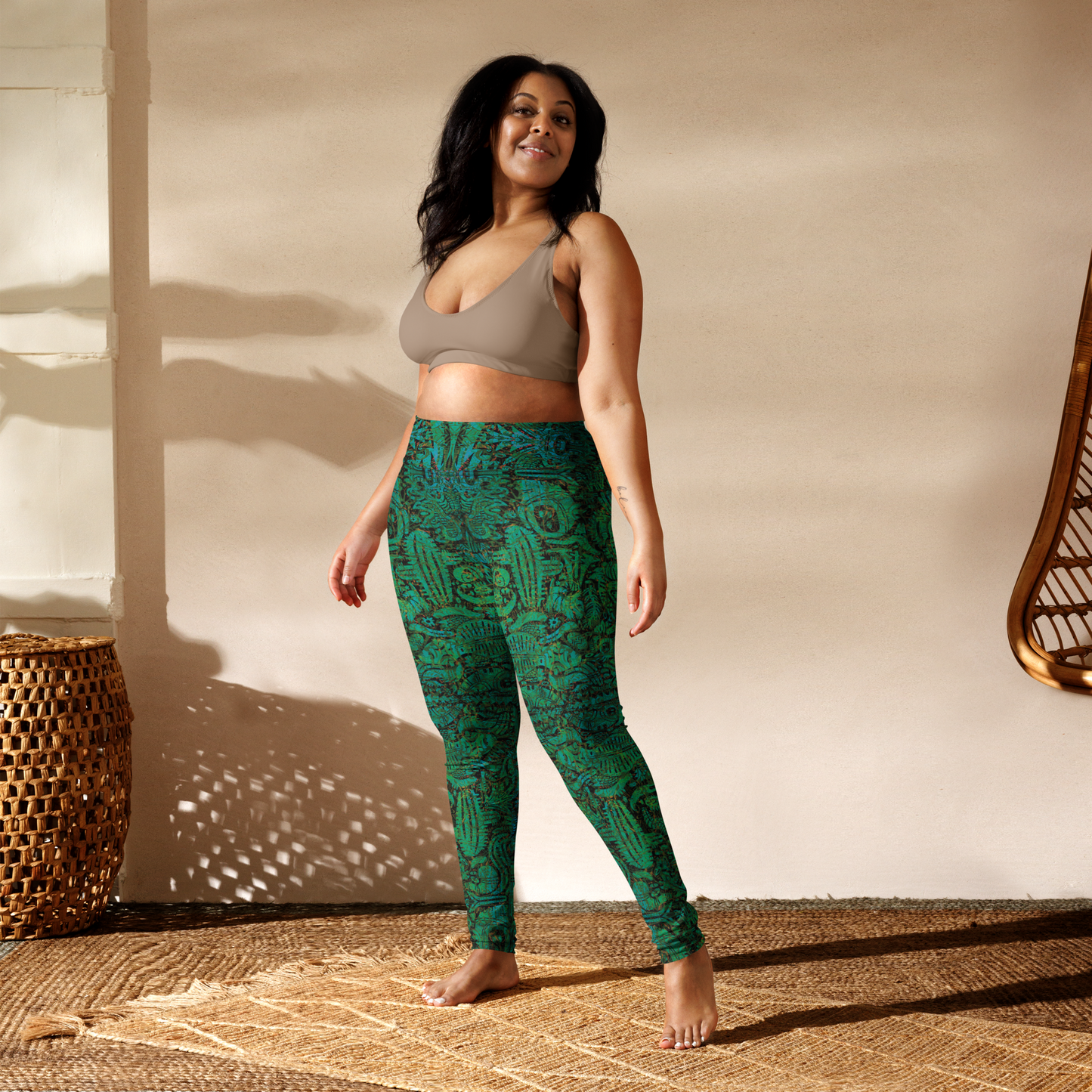 Model wearing turquoise mandala desert leggings