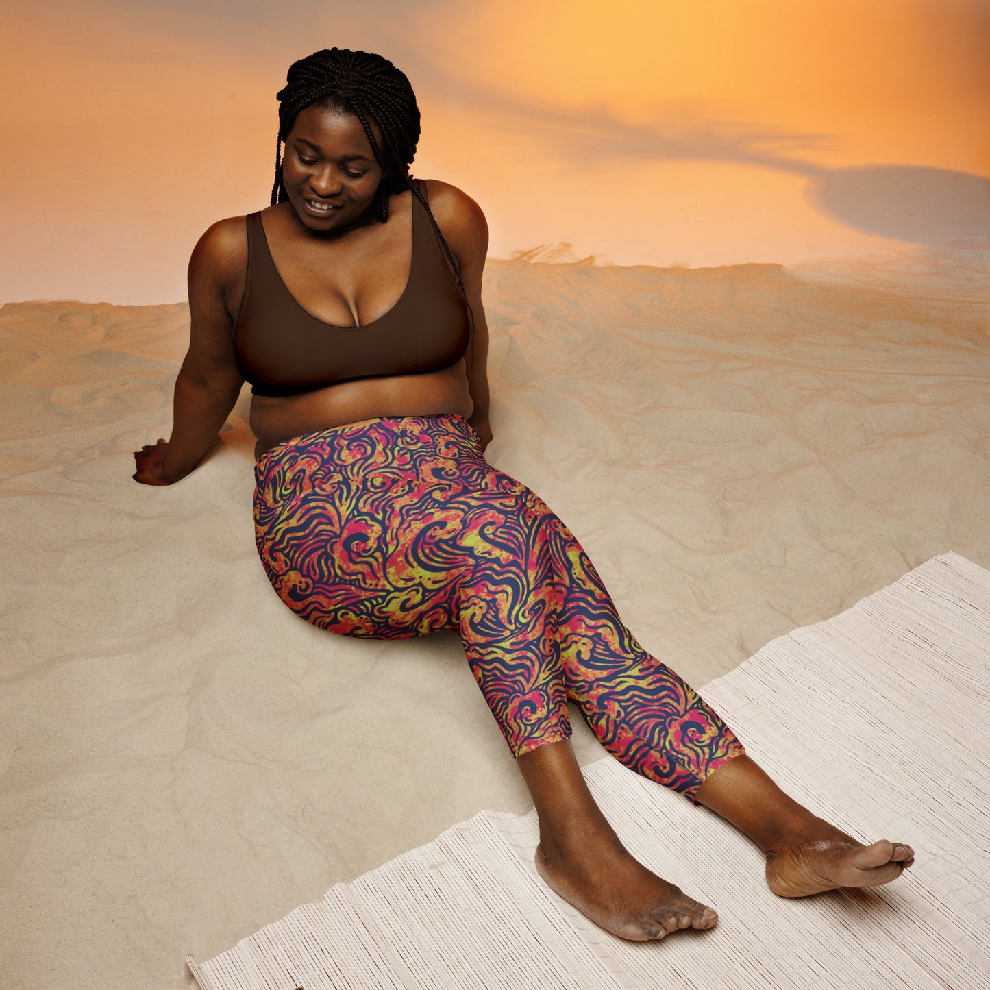 Orange, blue and pink wave-inspired psychedelic leggings designed by Fowl Plays Print Emporium.