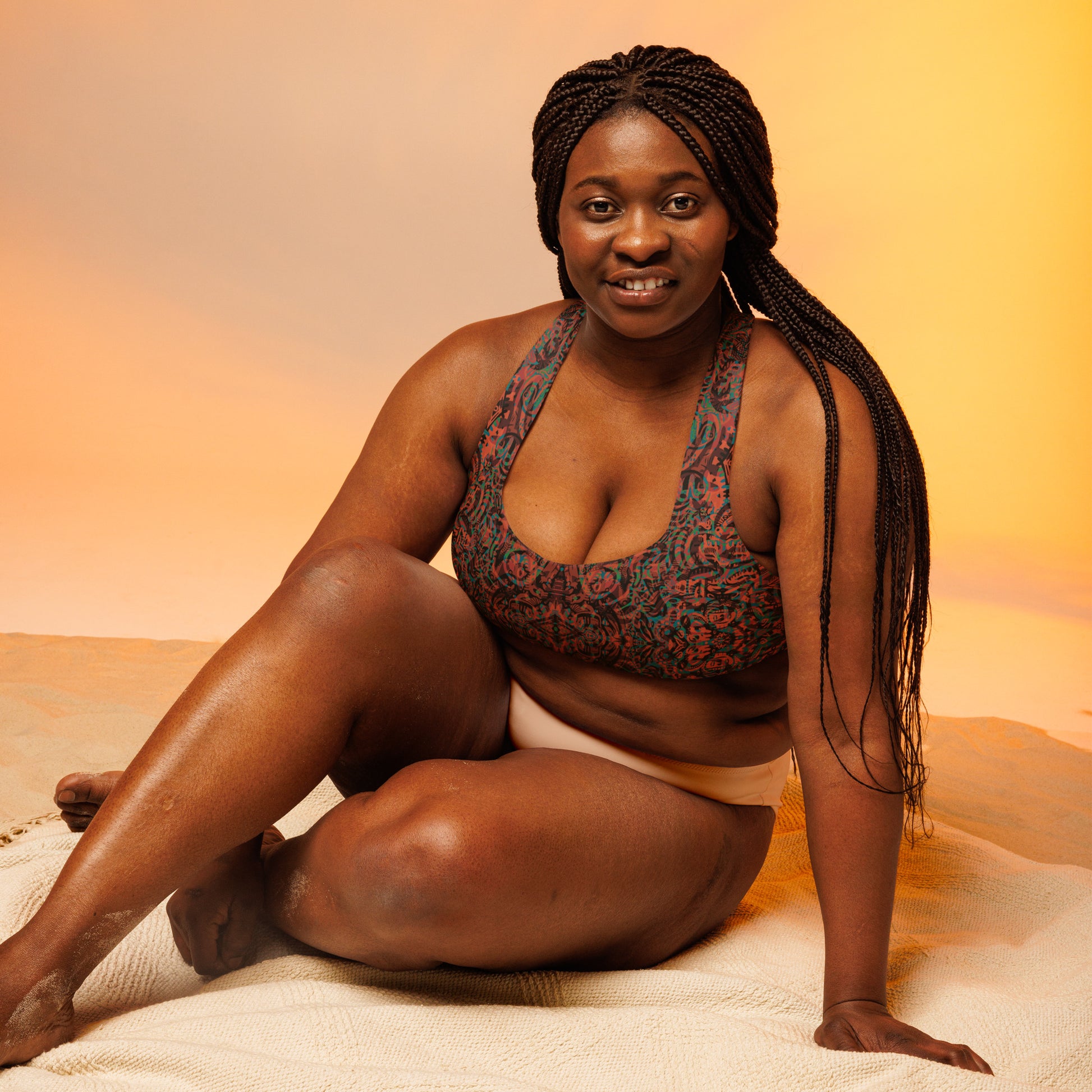 Psychedelic Kaleidoscope long line sports bra by Fowl Plays in burnt orange, green, and black psychedelic design