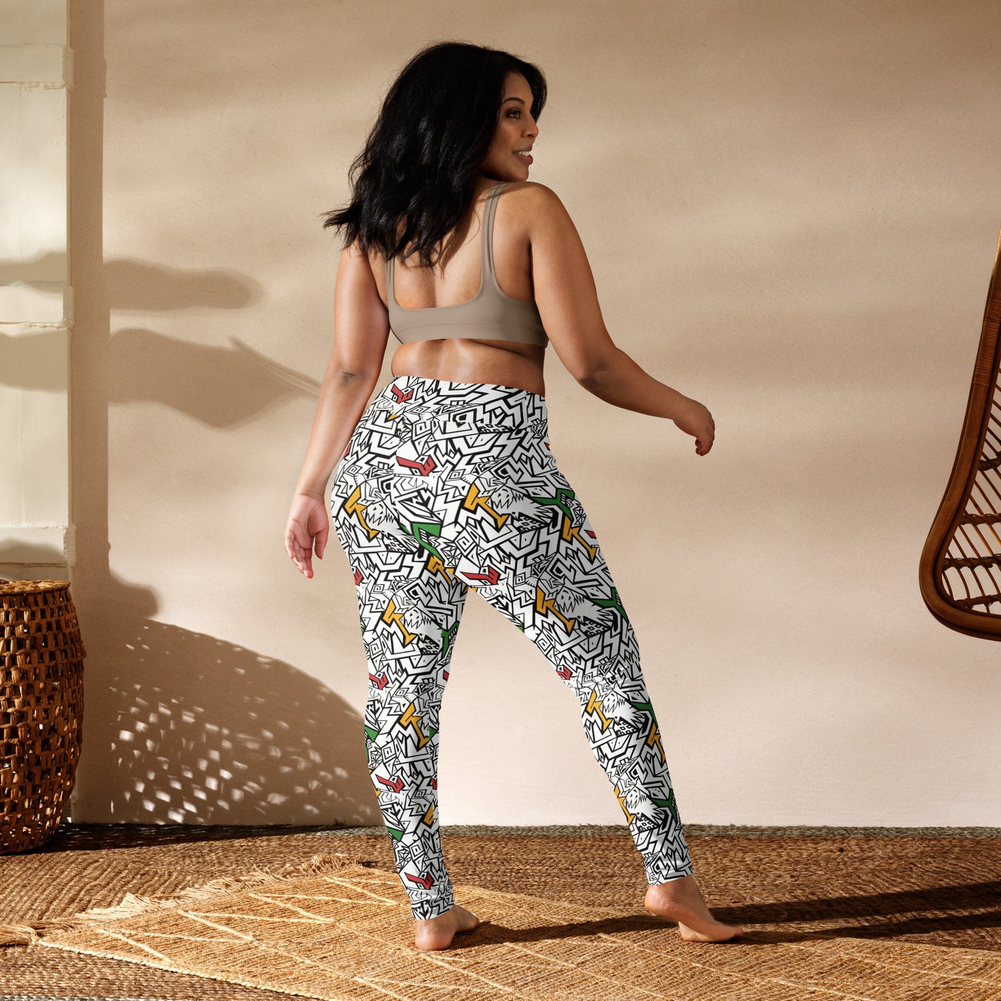 Model wearing bold patterned yoga leggings