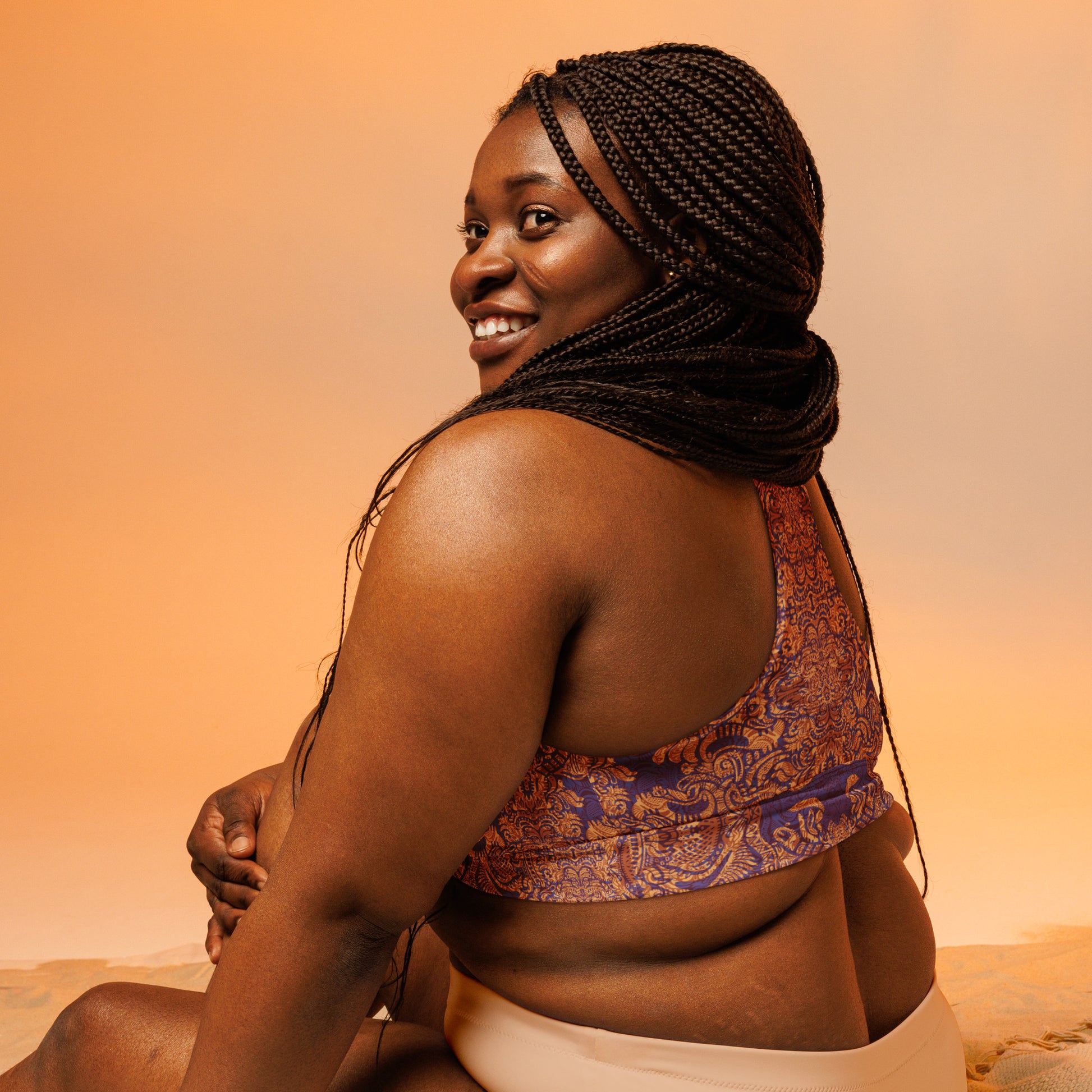 Purple and orange regal design crop top – Royal We Edition by Fowl Plays Print Emporium. back of plus size sports bra