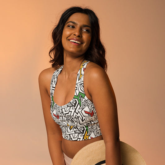 Black, white, red, gold and green psychedelic crop top with hidden “Smile At Life” message – exclusive sustainable design by Fowl Plays Print Emporium.